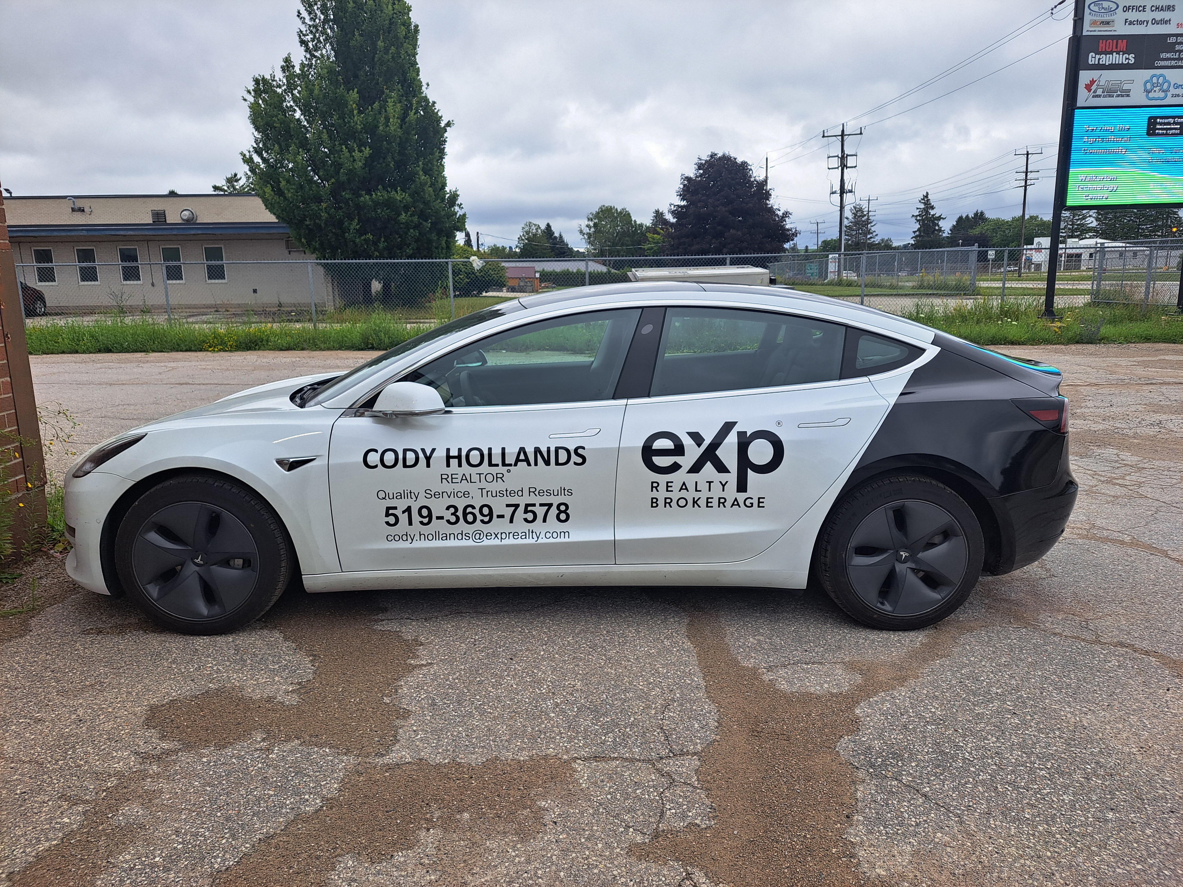 EXP Realty Tesla wrap
